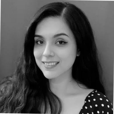 Arely Rivera smiling, in a black-and-white portrait.